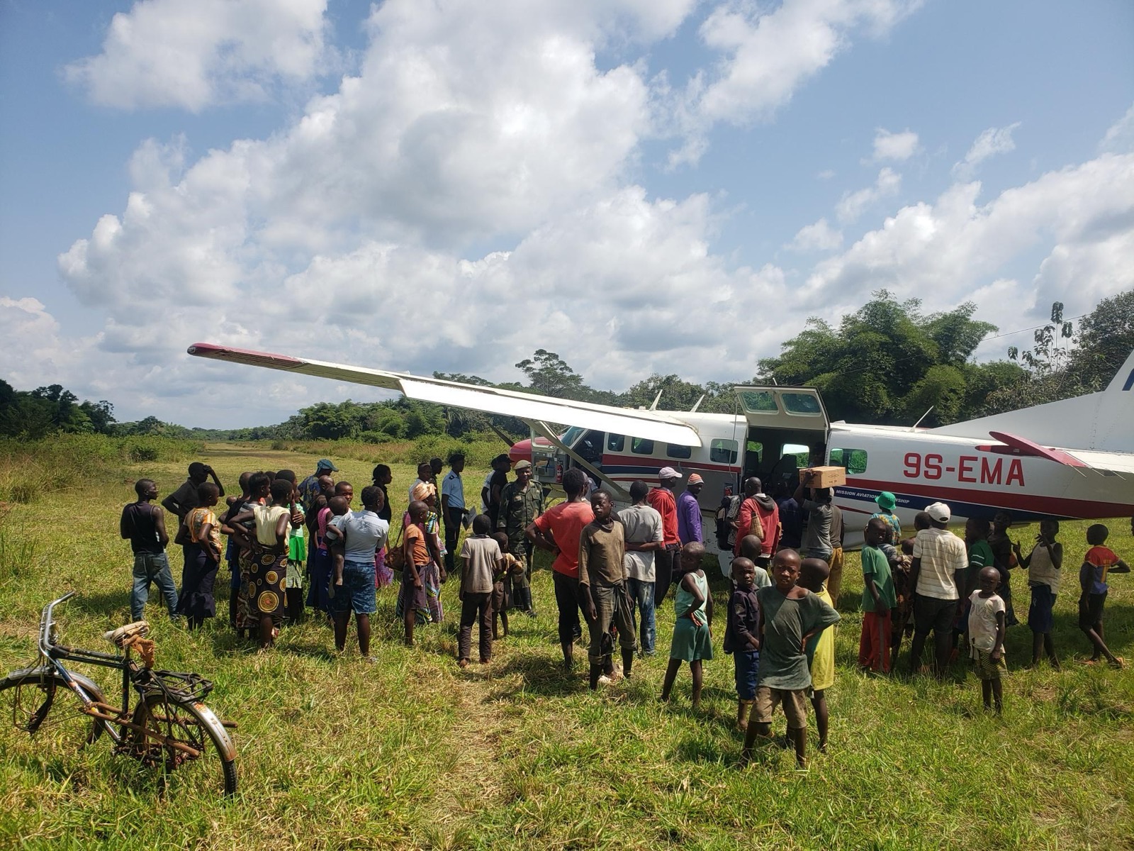 MAF plane with villagers in East DRC