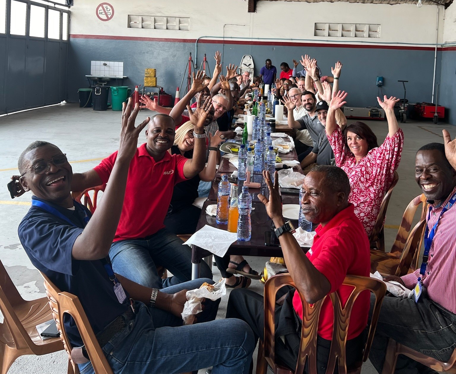 MAF board members and DRC national staff enjoy a meal together in the hangar